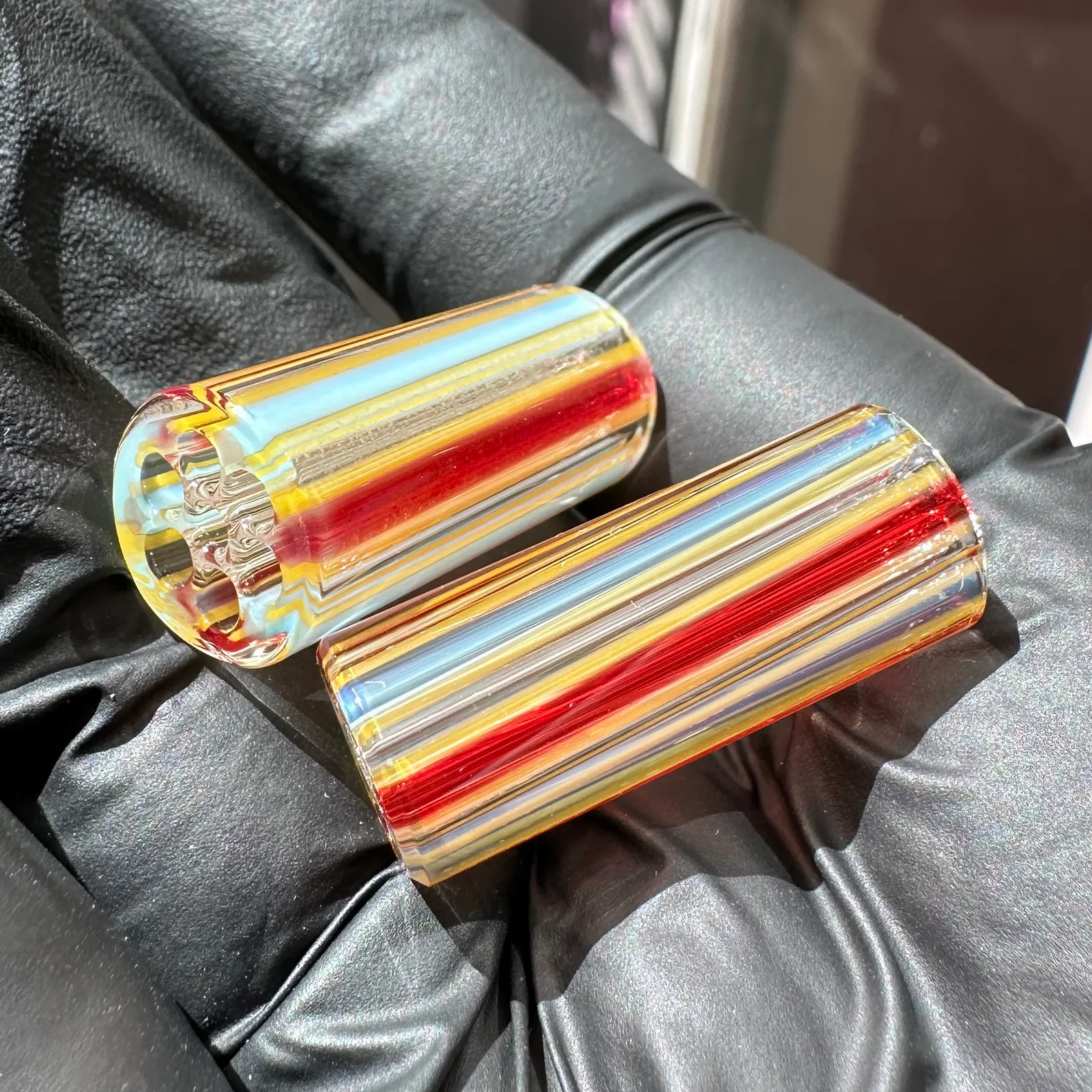 Close-up of Triad Shift glass tips with striped borosilicate color pattern